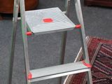 a ladder that is sitting in the middle of a room