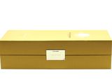 an image of a gold box with a white label on it