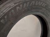 a close up of a tire on a white surface
