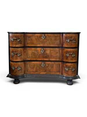 an antique chest of drawers with a wooden top and metal handles