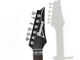 an electric guitar with a black neck and a white fretset