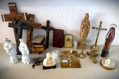 a lot of religious items on the table