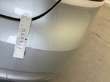 a sticker on the back of a car that has a price tag attached to it