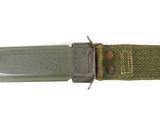 a knife that is laying on top of a piece of cloth