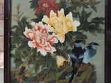 a picture of a painting of birds and flowers on display