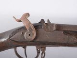 an old gun with a wooden handle on a white background