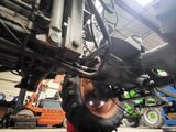 a tractor that is being worked on in the garage
