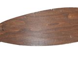 a wooden fish that is hanging on the wall