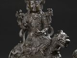 pair of chinese silver figurines of a seated woman and a lion