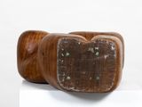a wooden object that is sitting on top of a table