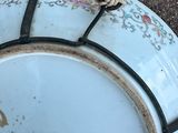 a plate with a rope on it sitting on the ground