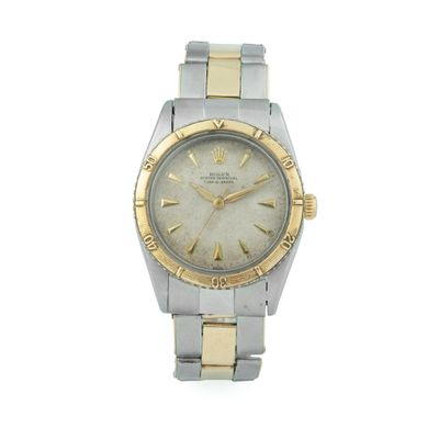 une photo d'une montre Rolex pour femme avec un bracelet bicolore