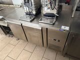 two coffee machines on the counter in the kitchen
