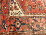 an image of a red and blue rug with a pattern on it