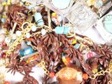 a pile of assorted necklaces and bracelets on a table