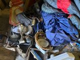 a pile of clothes and other items on the floor of a room