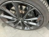 a close up of a tire on a car ' s rim