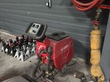 a picture of a garage with a lot of tools on the floor
