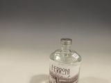 a small bottle of alcohol sitting on a table