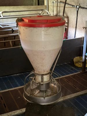 an image of a machine that is pouring milk into a container