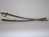 an image of a sword with a wooden handle