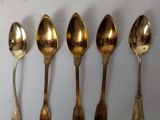 a lot of spoons and spoon spoons on the table