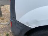 a white van parked on the side of the road