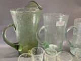 a lot of glass items that are sitting on a table