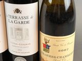 three bottles of wine sitting next to each other on a table
