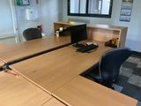 a desk with a computer and a monitor on it