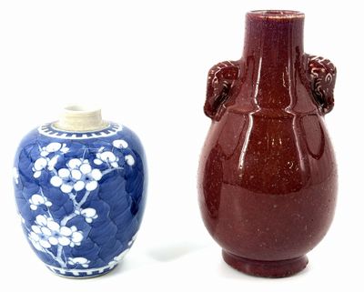 two vases sitting next to each other on a white surface