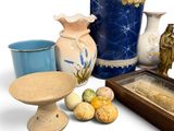 many vases and other items that are sitting on a table