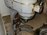 a white mixer in the corner of a room