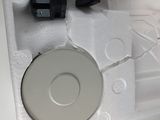 a white box with a cd in it on a table