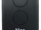 an image of a close up of a remote control on a white surface