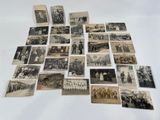 several old black and white photographs of men and women on a table