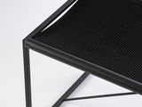black metal coffee table with mesh top on white background