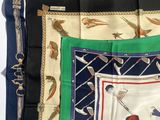 four different colored handkerchiefs with a picture of a man on a golf course
