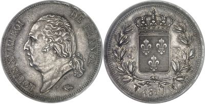 a close up of a coin with a crown on top of it