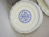 two plates with blue and white designs on them