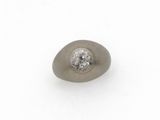 a close up of a single stone with a diamond in it