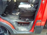 a suitcase in the back of a red car