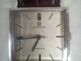 an image of a wrist watch with a brown leather strap