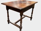 a small table with a wooden top on a white background