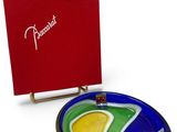 a blue and green plate with a red box in the background