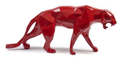 the red sculpture of a cheetah is standing on a white surface