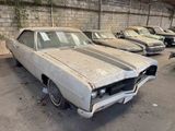 many old cars that are parked in a garage