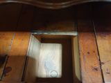 a wooden table with a mirror on top of it