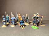 many figurines of men dressed in blue uniforms