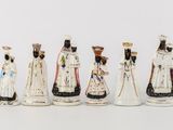 seven figurines of different sizes and colors